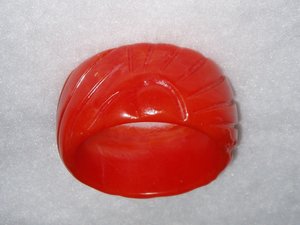 French Bakelite Galalith Galilith Bangle, Red-Orange Stylized Rising Sun Design