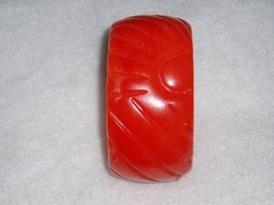 French Bakelite Galalith Galilith Bangle, Red-Orange Stylized Rising Sun Design